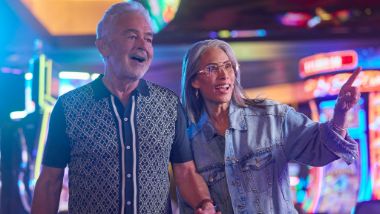 Two Players Smiling and Walking the Casino Floor