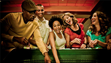 crowd of people playing craps