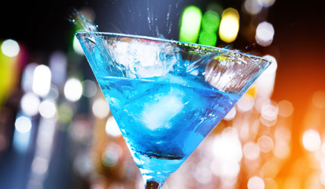 blue drink in martini glass